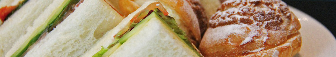 Eating Sandwich at Spuds Your Way restaurant in Hamden, CT.